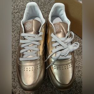 women size 6 rose gold reebok sneaker, brand new, never worn.